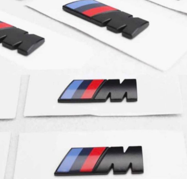 Black M emblem on the trunk