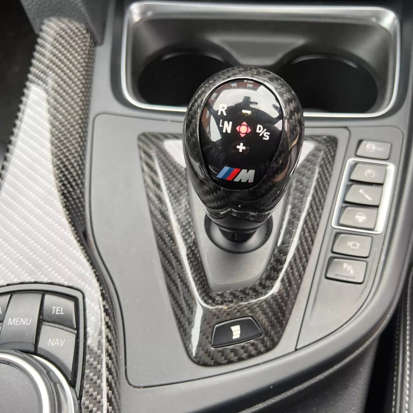 Carbon fiber trim for M DCT transmissions