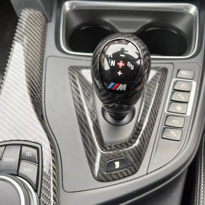 Carbon fiber trim for M DCT transmissions